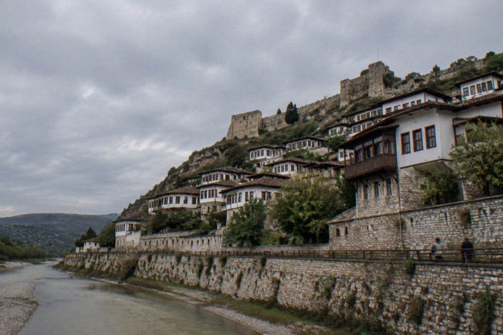 Ottoman houses stacked on a hillside above the Osum River in Berat