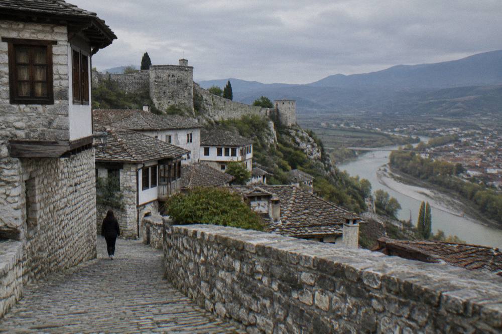 Cobbled lane and old stone houses inside the walled castle quarter of Berat