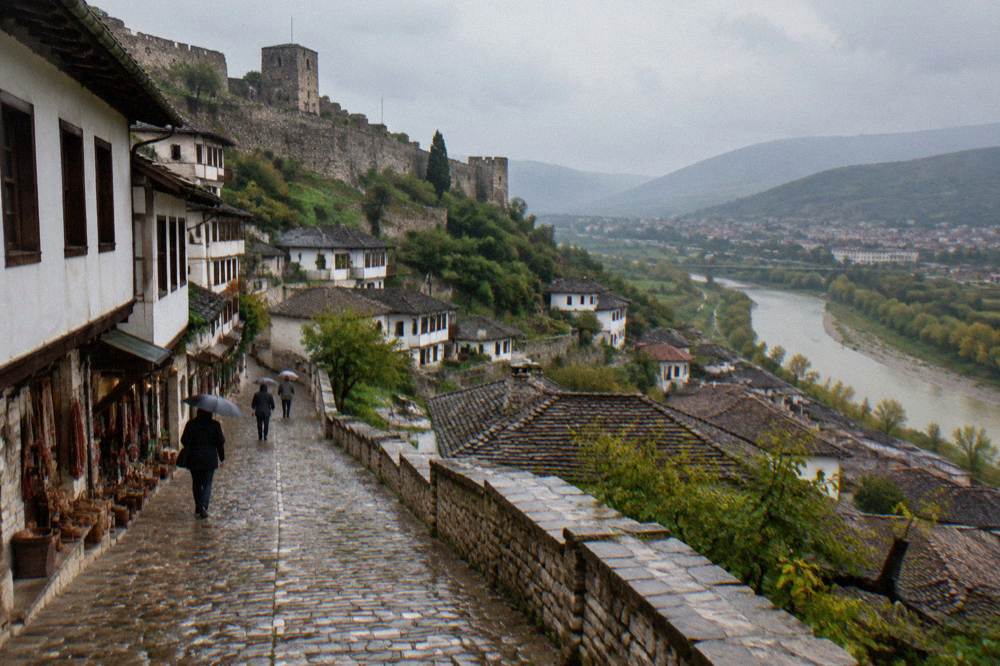 Cobbled Ottoman-era street in Berat lined with small shop fronts