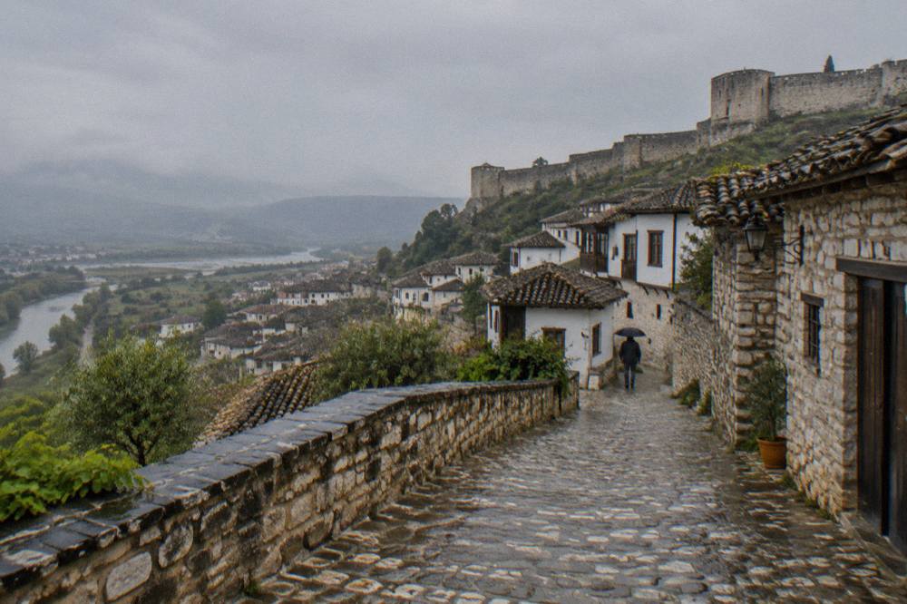 Cobbled lane with stone houses inside Berat Castle