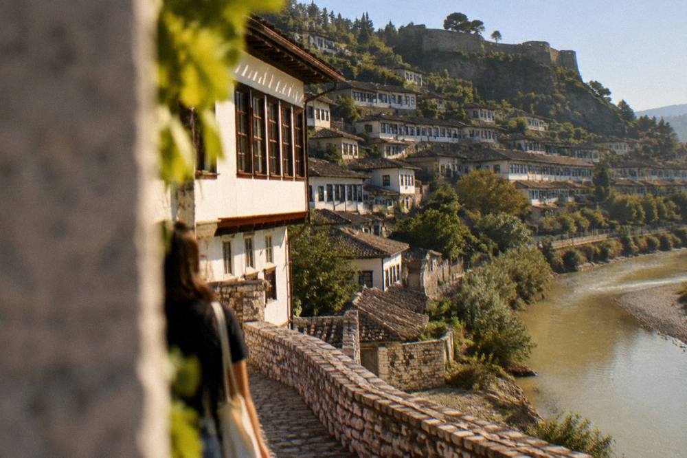 Golden evening light on white Ottoman houses above a river bend