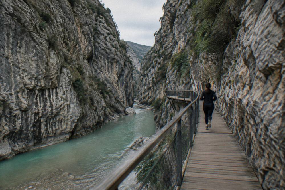 Turquoise water between steep limestone walls in the Osumi Canyon