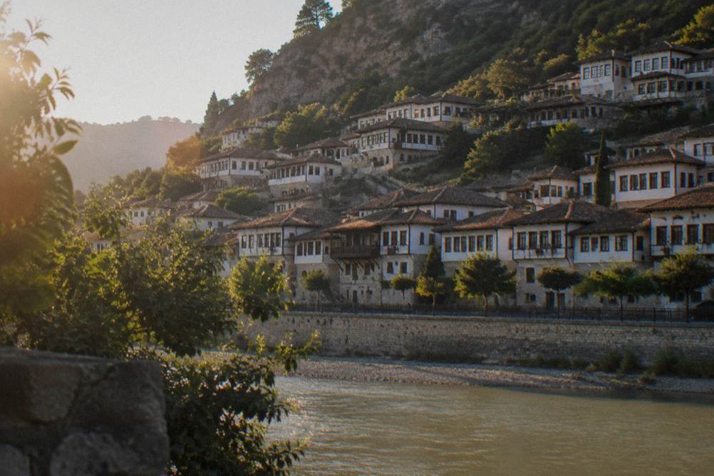 Historic houses of the Gorica quarter seen across the Osum River