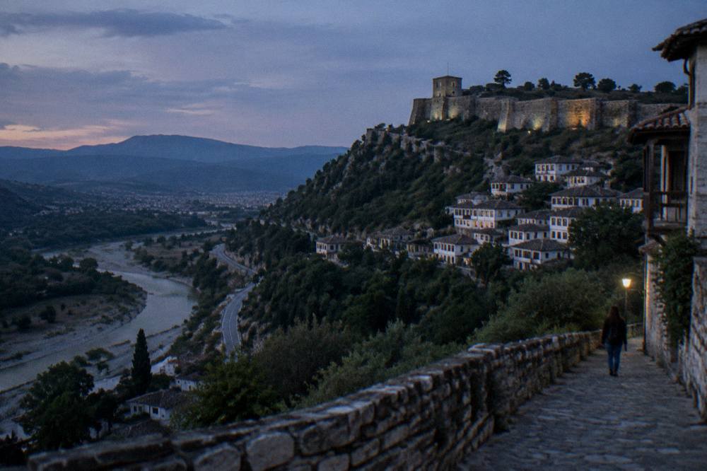 A mountain road winding through green hills between Berat and the Adriatic coast