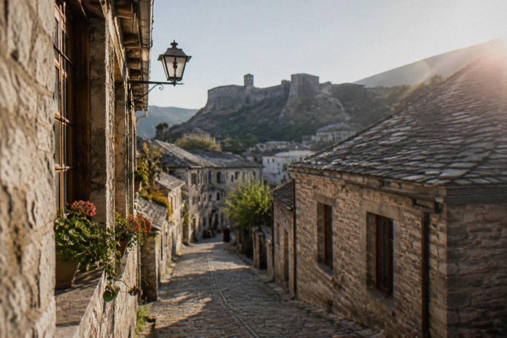 A cobbled old street lined with stone buildings in an Ottoman-era town