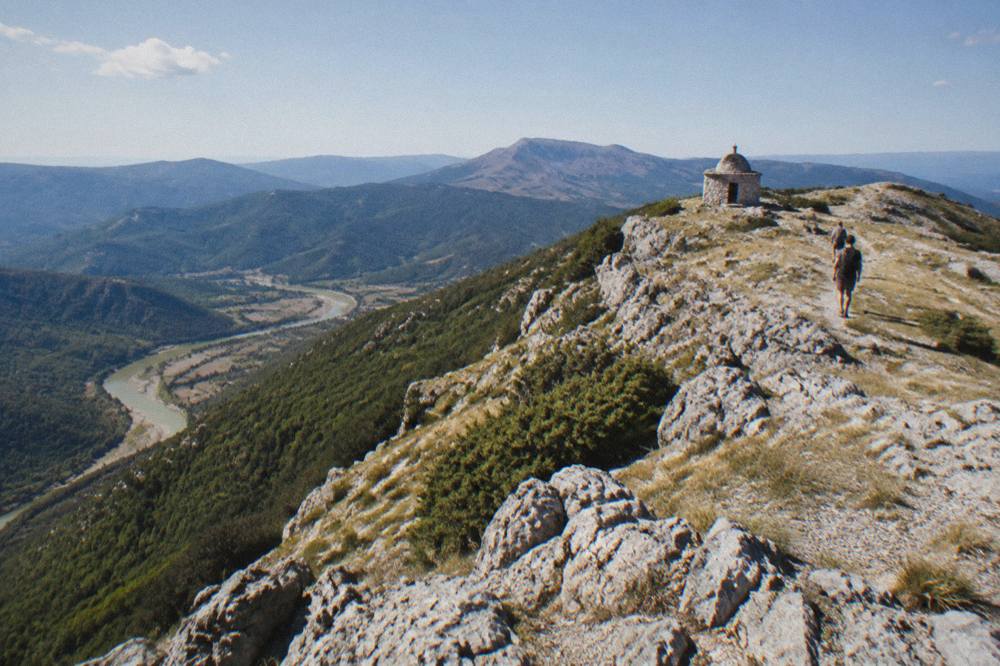 Rocky summit ridge of Mount Tomorr under a wide open sky