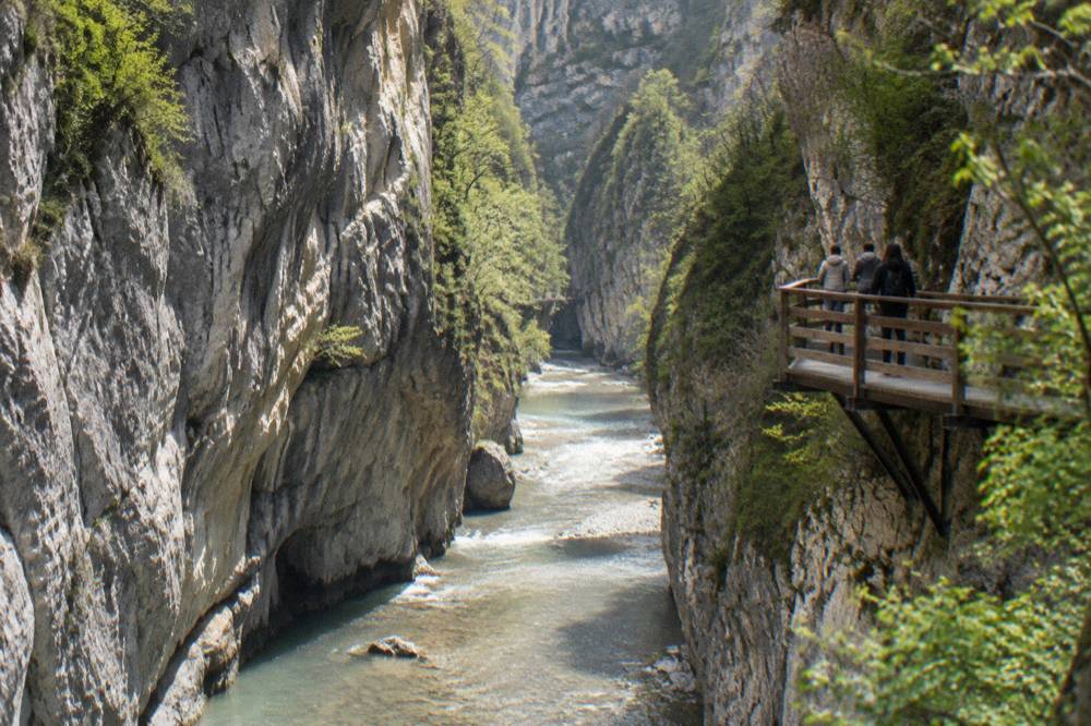 Spring meltwater rushing between narrow limestone walls in Osumi Canyon