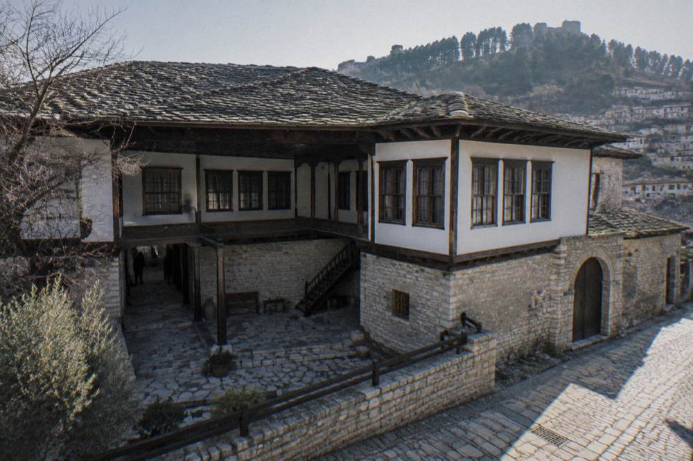 Historic stone building of the Ethnographic Museum in Berat with a level street entrance