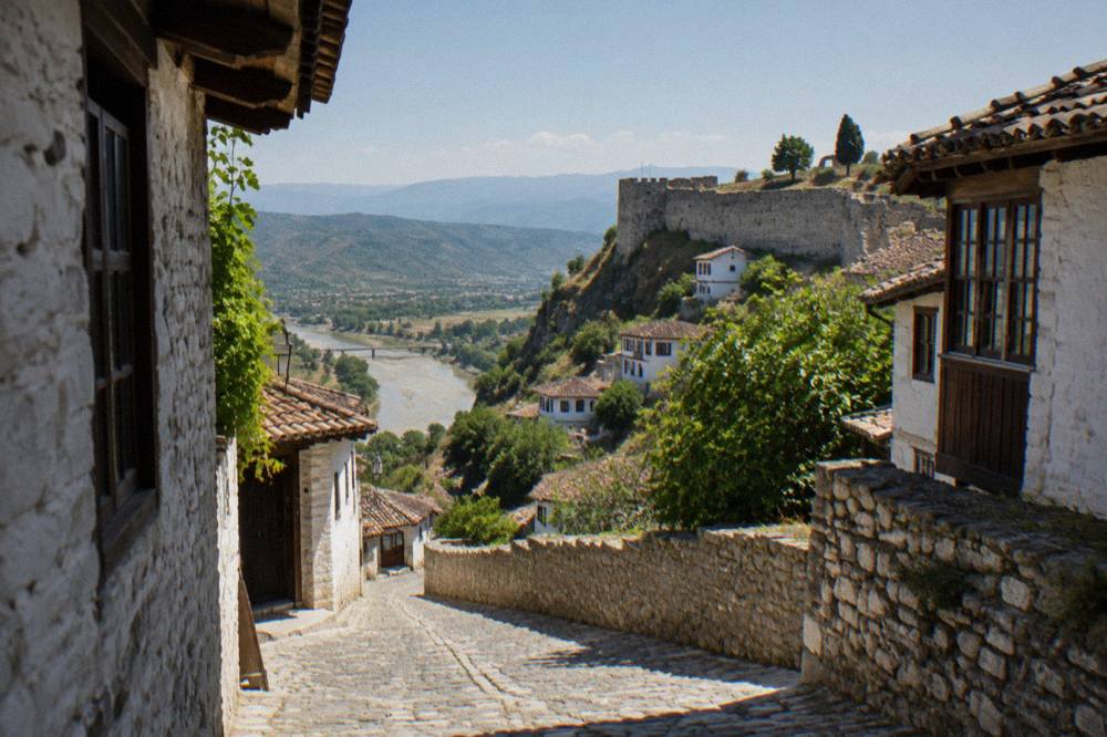 Narrow stone street with old houses inside the castle quarter of Berat