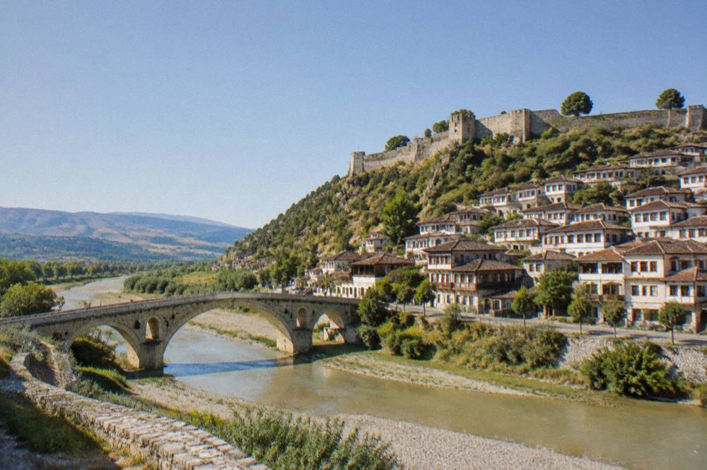Historic stone bridge over the Osum River connecting the two old quarters of Berat