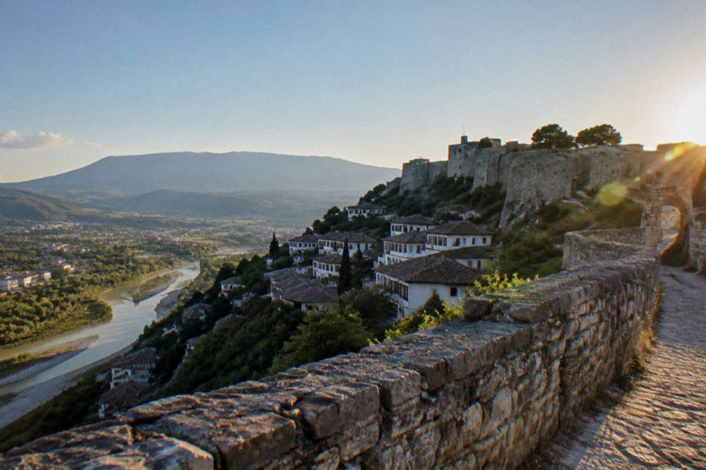 Mountain landscape with a stone pilgrimage site above the Berat countryside