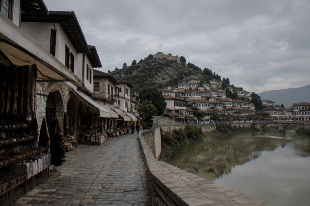 The Osum River running below Berat with the old town reflected on the water surface