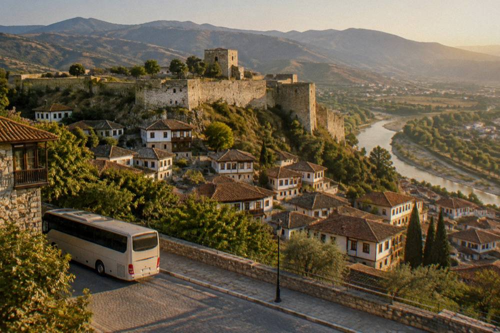 A bus parked on a street on the outskirts of Berat with hills behind