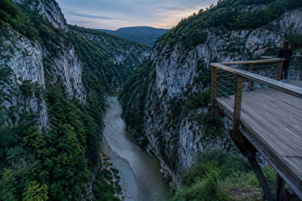 Green walls of Osumi Canyon rising above the river