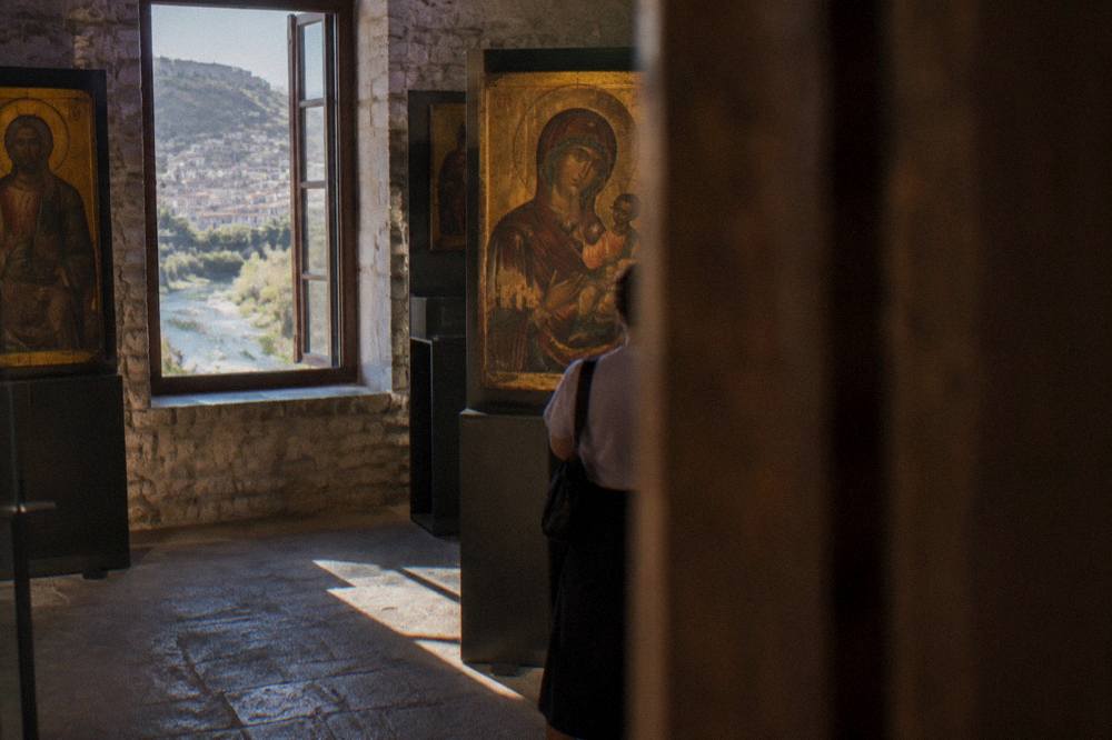 Museum interior with painted icons on display