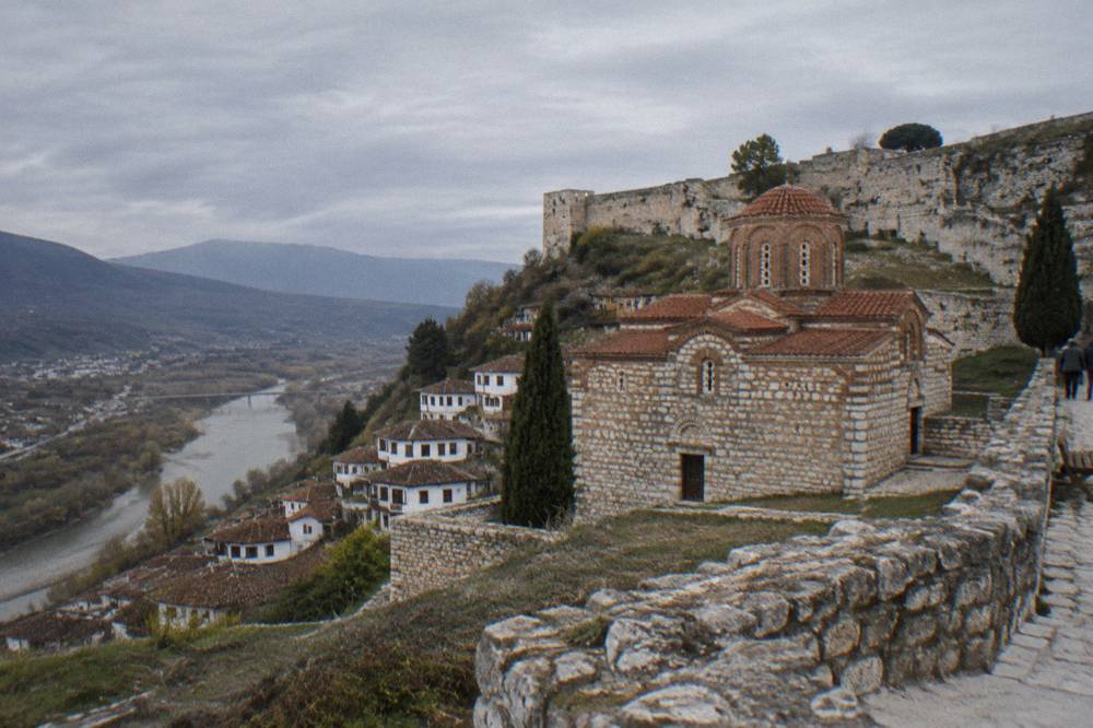 Red-roofed old church building housing a museum inside the walls of Berat Castle