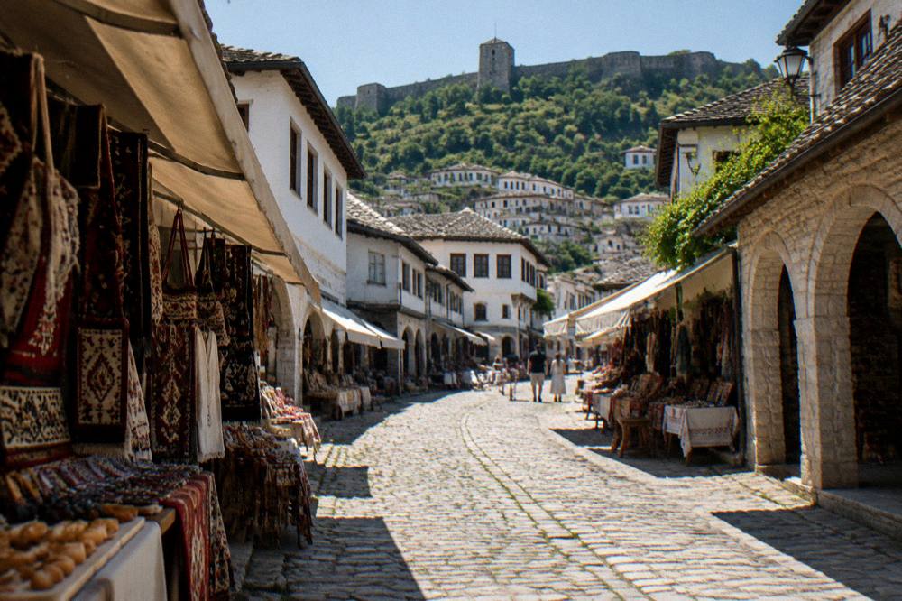 Narrow cobbled lane of whitewashed houses in the Mangalem old town