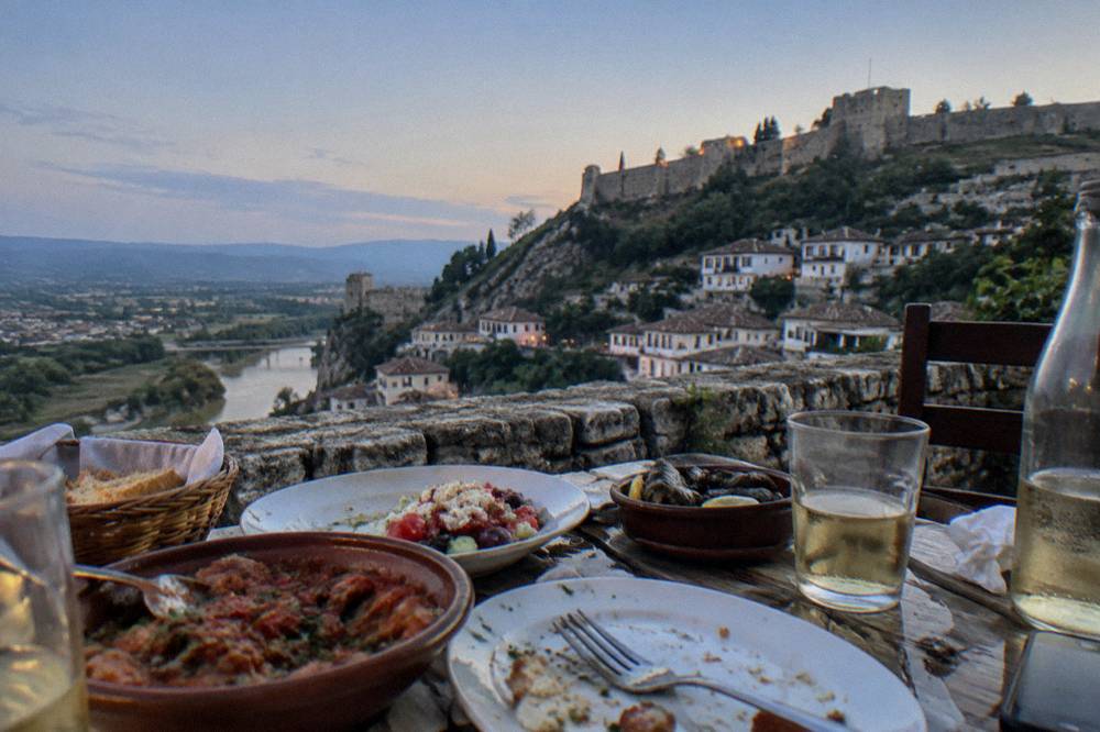 Traditional Albanian dishes served on a table in a Berat restaurant