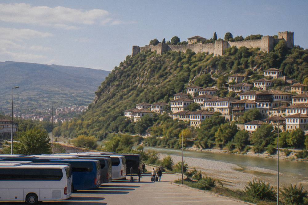 Buses lined up at the Tirana South-North terminal under a morning sky