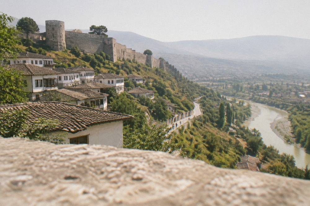 A winding road through green hills in central Albania