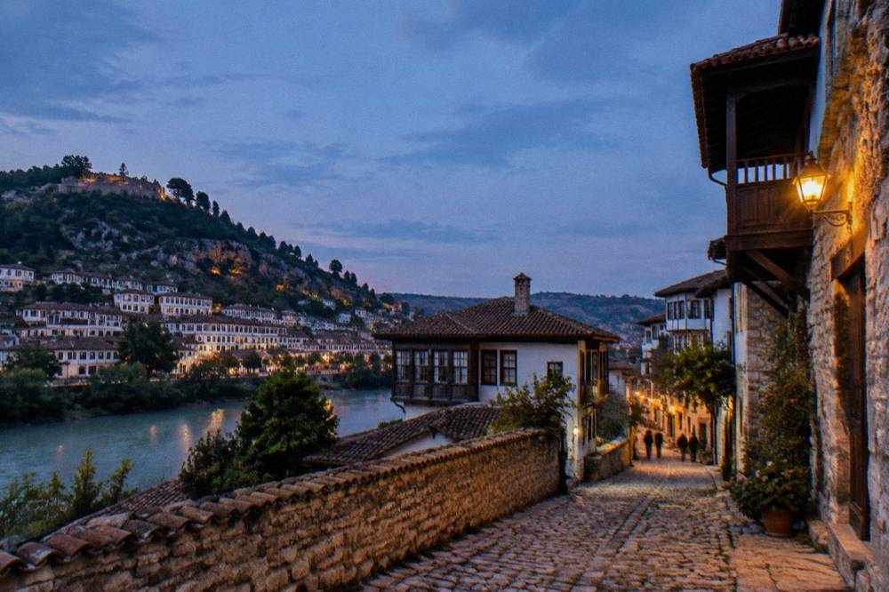 Narrow cobbled lane in Gorica with stone houses and warm evening light